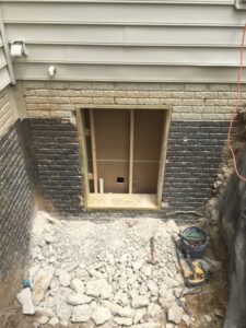 image of installation of an egress window